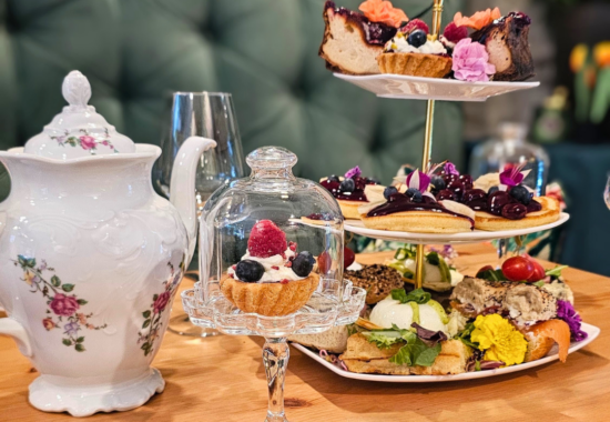 Sharing brunch in Krakow, a tiered stand of sweet and savoury bites with Prosecco