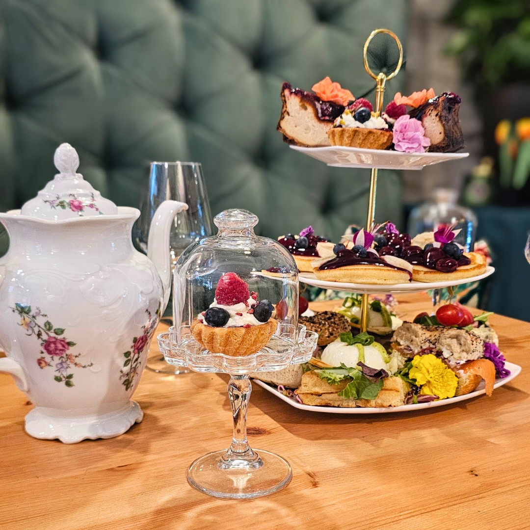 Sharing brunch in Krakow, a tiered stand of sweet and savoury bites with Prosecco
